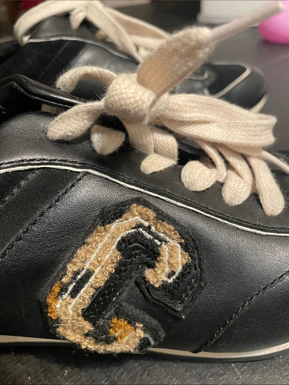Coach -Black Lace-Up Sneakers with Tan Heel Accent and Embroidered Leopard Patch